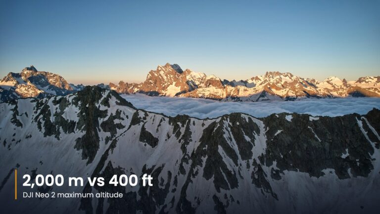 Snow-capped mountain range seen from above the clouds